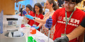 Ambassadors working in a lab.
